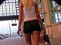 Now that's a real bimbo! Or at least she looks like one. Great girl in short top and hot shorts with open legs and belly